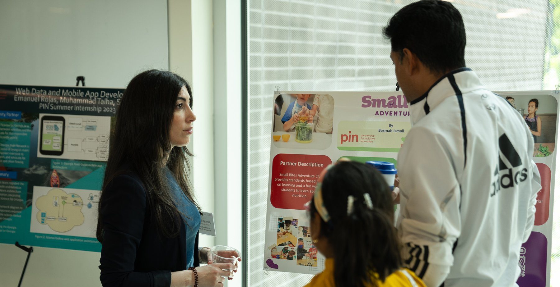 A group presents their findings through a poster presentation